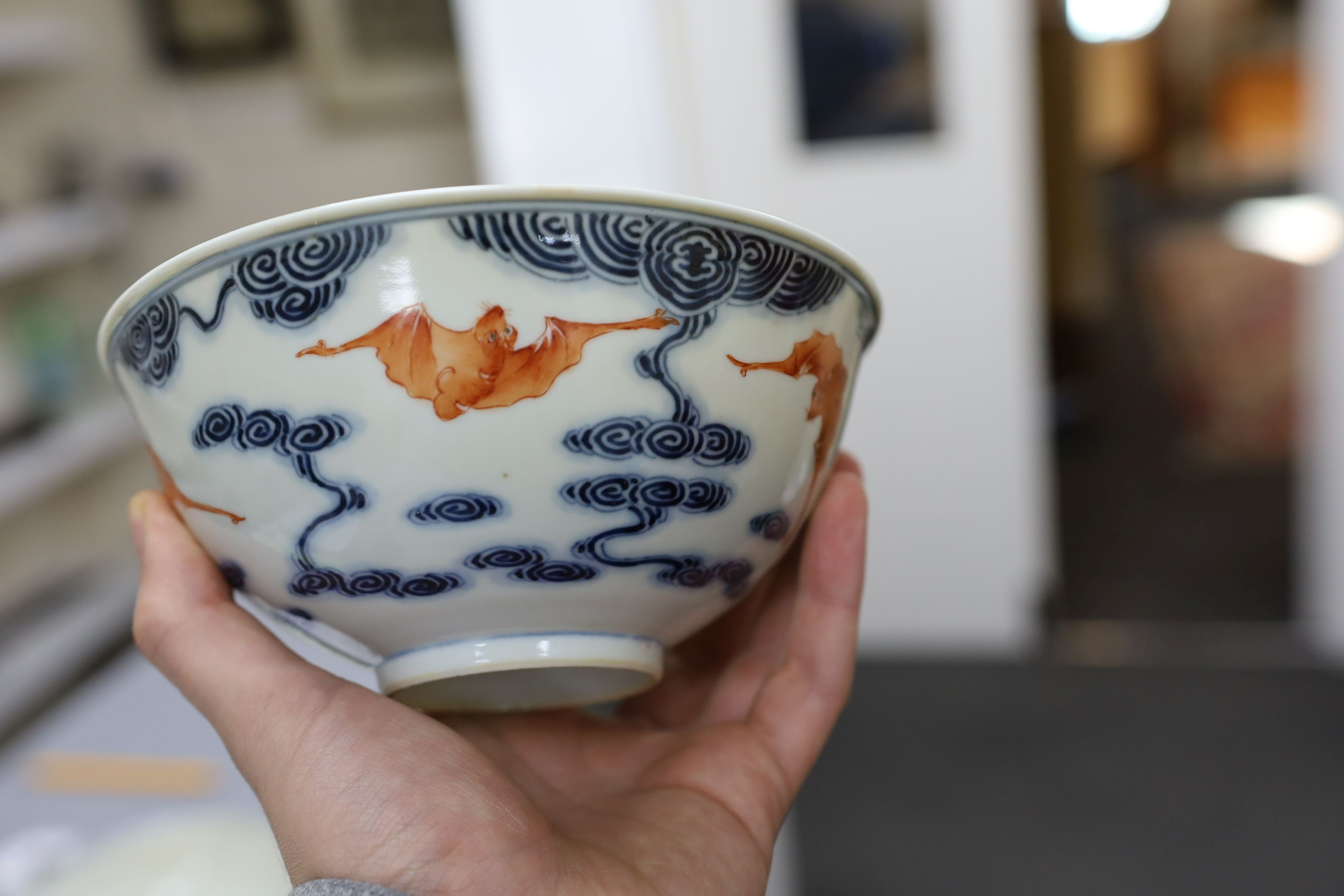 A pair of Chinese iron red and underglaze blue ‘five bat’ bowls, Guangxu mark and probably of the period (1875-1908), 16.5cm diameter